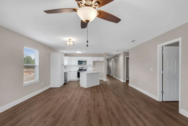 a view of a living room and hardwood floor