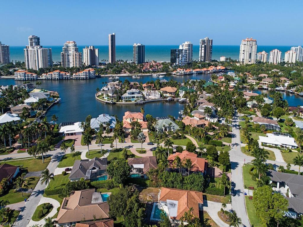 4406 Crayton Road Naples, FL 34103 - Photo 4 of 8 a view of a city with tall buildings
