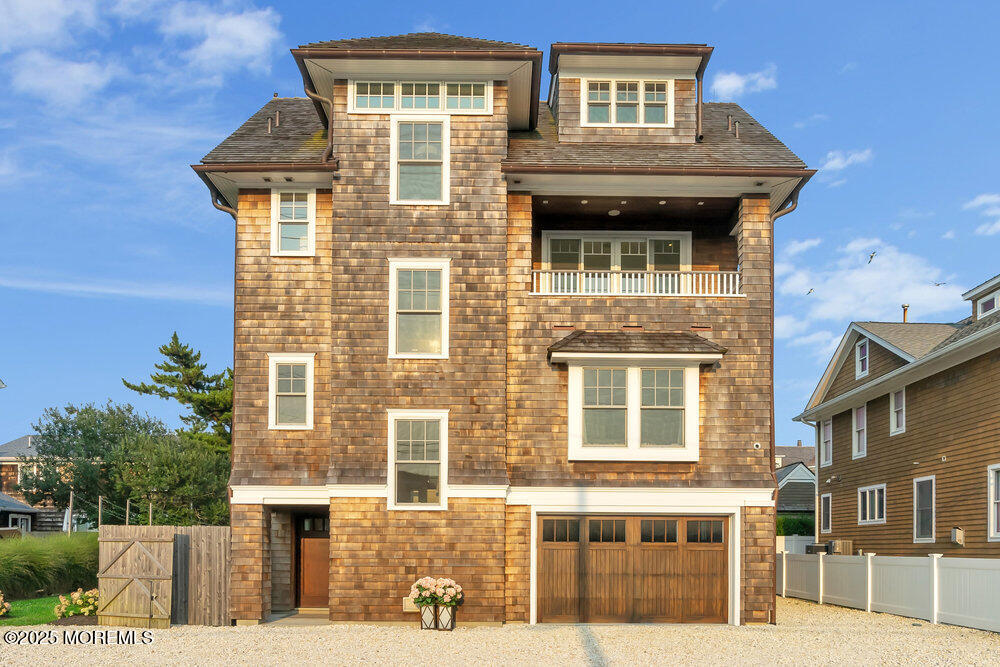 985 North Ocean Avenue Mantoloking, NJ 08738 - Photo 1 of 163 a front view of a house with a yard