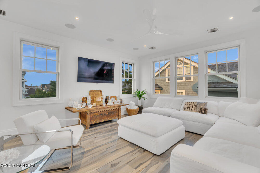 985 North Ocean Avenue Mantoloking, NJ 08738 - Photo 111 of 163 a living room with furniture and a flat screen tv