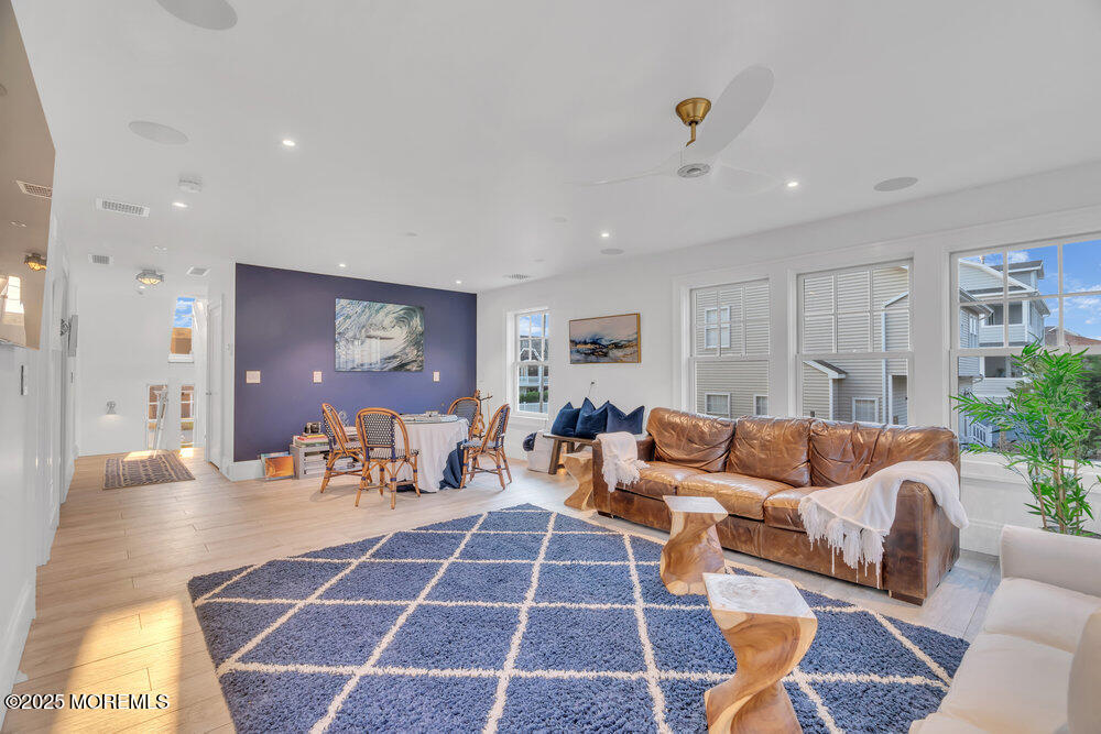 985 North Ocean Avenue Mantoloking, NJ 08738 - Photo 124 of 163 a living room with furniture a dining table and a potted plant
