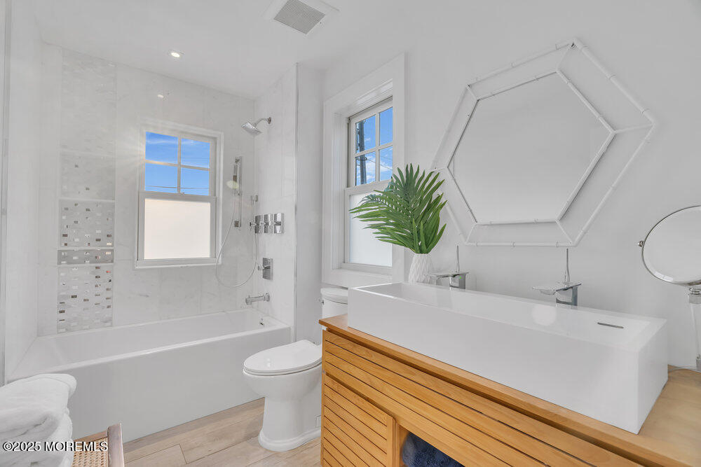 985 North Ocean Avenue Mantoloking, NJ 08738 - Photo 131 of 163 a bathroom with a sink a toilet and a bathtub