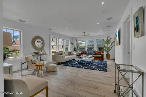 a view of a living room and a balcony