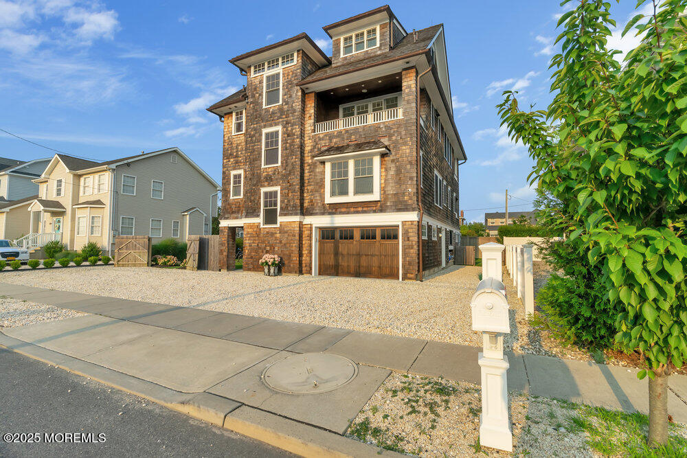 985 North Ocean Avenue Mantoloking, NJ 08738 - Photo 32 of 163 a front view of a house with a yard