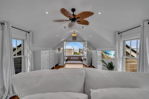 a living room with fireplace furniture and a wooden floor