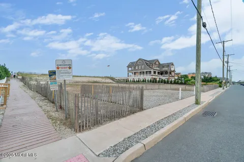 a large bedroom with a bed and a lamp