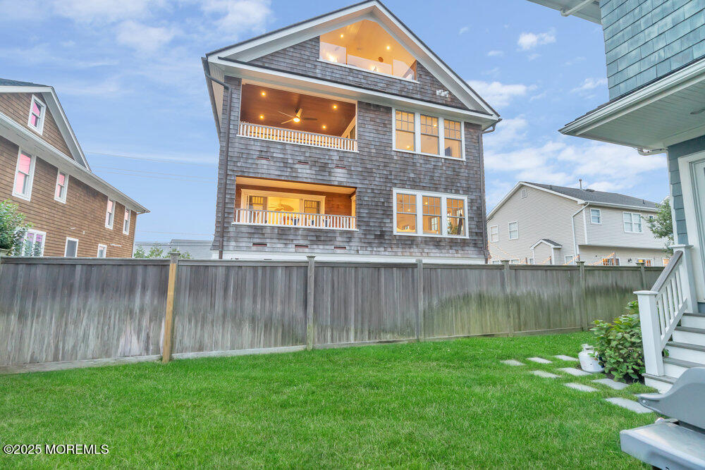 985 North Ocean Avenue Mantoloking, NJ 08738 - Photo 44 of 163 a front view of a house with a yard and lake view