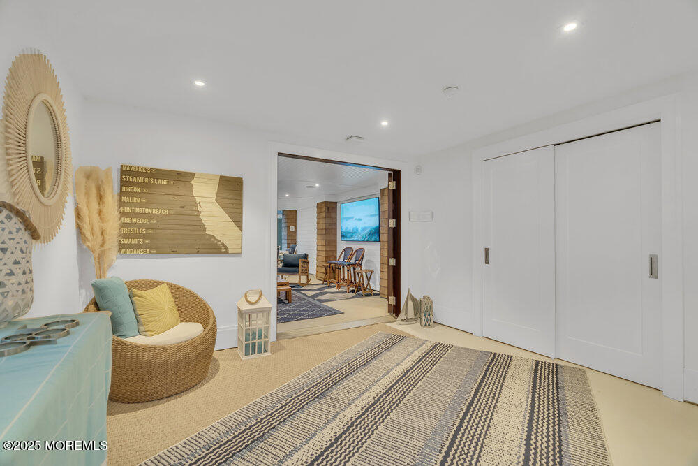 985 North Ocean Avenue Mantoloking, NJ 08738 - Photo 51 of 163 a living room with furniture and a rug