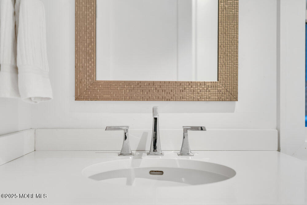 985 North Ocean Avenue Mantoloking, NJ 08738 - Photo 53 of 163 a bathroom with a sink and a mirror