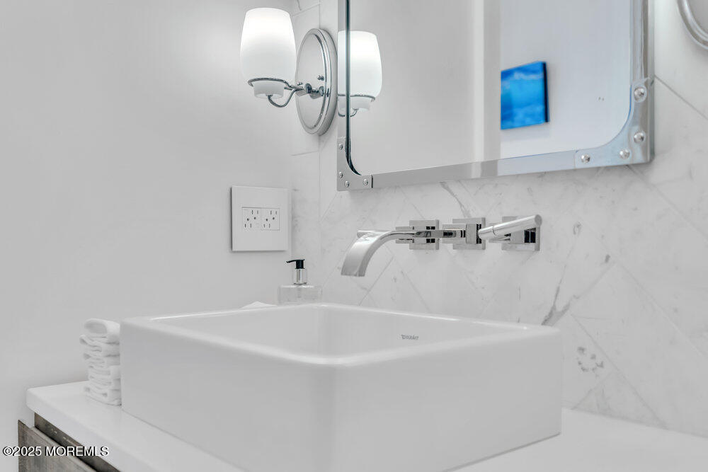 985 North Ocean Avenue Mantoloking, NJ 08738 - Photo 68 of 163 a white bath tub sitting next to a white sink