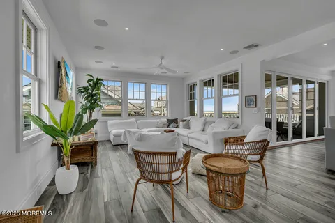 a living room with furniture or wooden floor and a potted plant