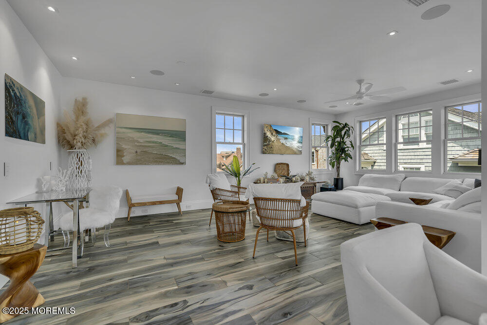985 North Ocean Avenue Mantoloking, NJ 08738 - Photo 9 of 163 a living room with fireplace furniture and a wooden floor