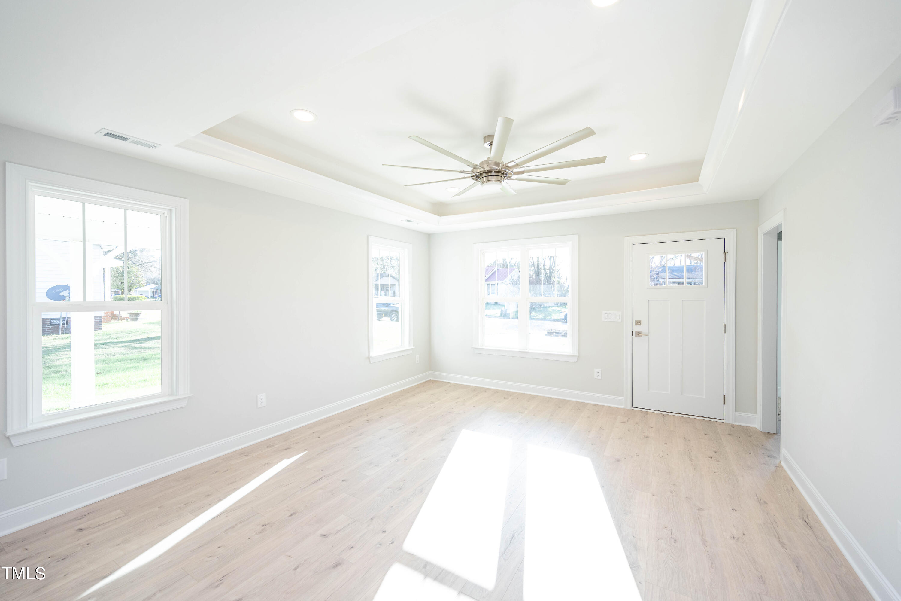 120 Jupiter Drive Dunn, NC 28334 - Photo 13 of 40 an empty room with windows and ceiling fan