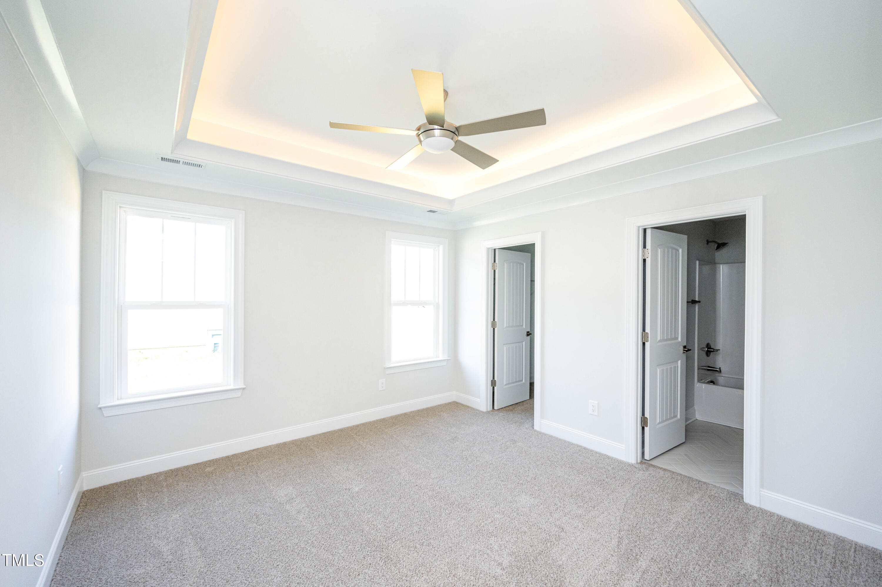 120 Jupiter Drive Dunn, NC 28334 - Photo 14 of 40 an empty room with windows and fan