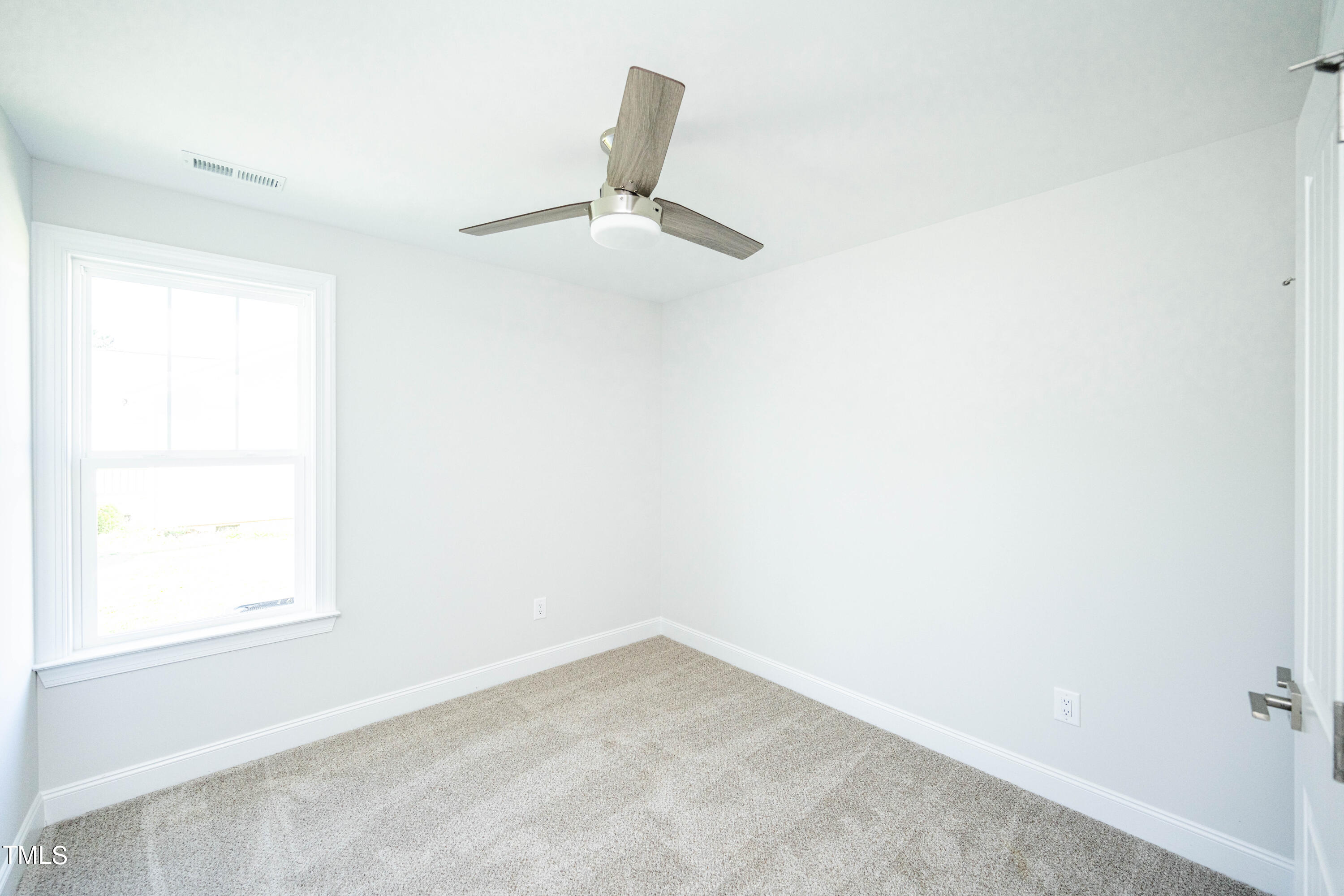 120 Jupiter Drive Dunn, NC 28334 - Photo 19 of 40 an empty room with a window