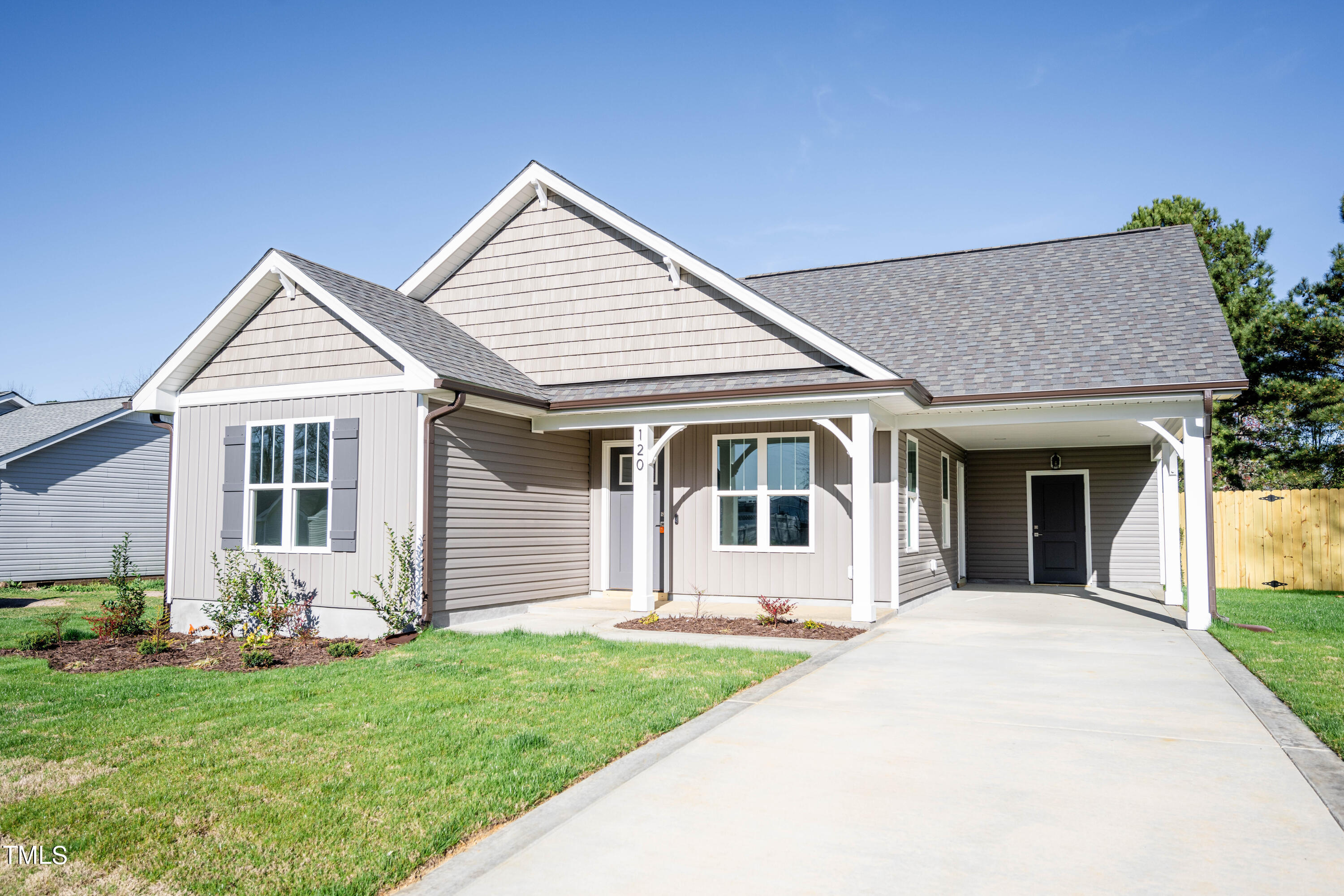 120 Jupiter Drive Dunn, NC 28334 - Photo 2 of 40 a front view of a house with a yard