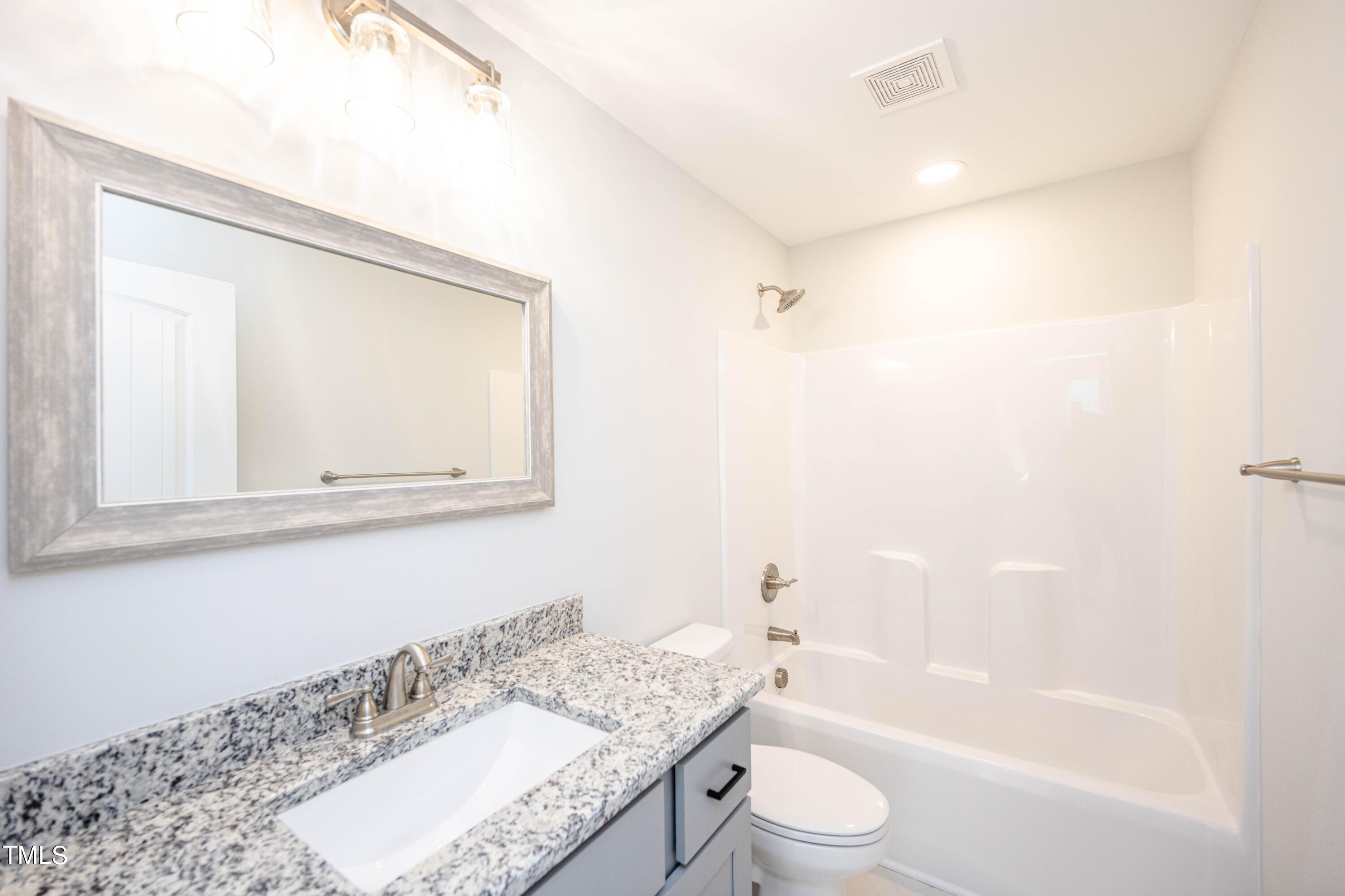 120 Jupiter Drive Dunn, NC 28334 - Photo 21 of 40 a bathroom with a granite countertop sink a toilet and bathtub