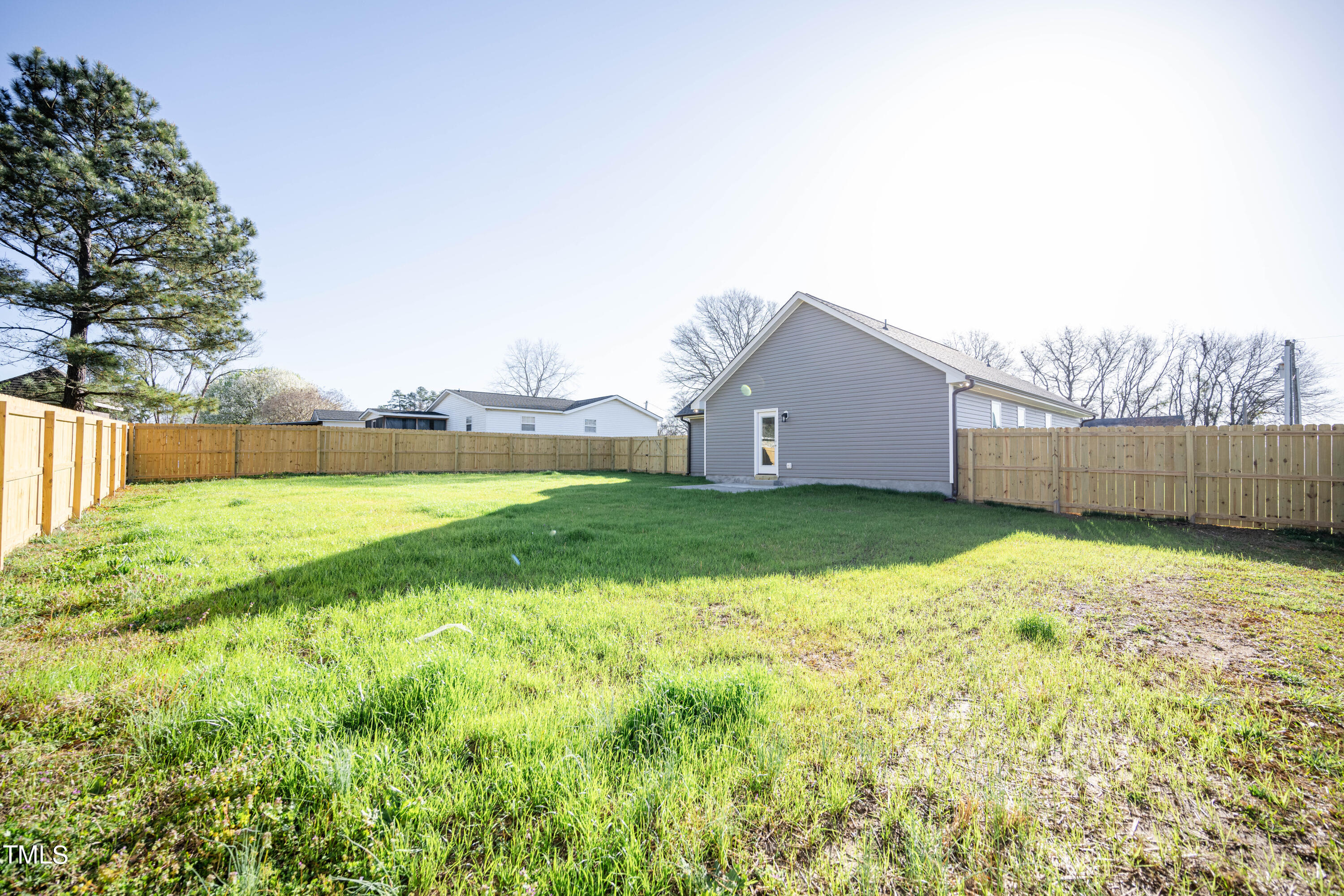 120 Jupiter Drive Dunn, NC 28334 - Photo 31 of 40 a view of a backyard with a garden and plants