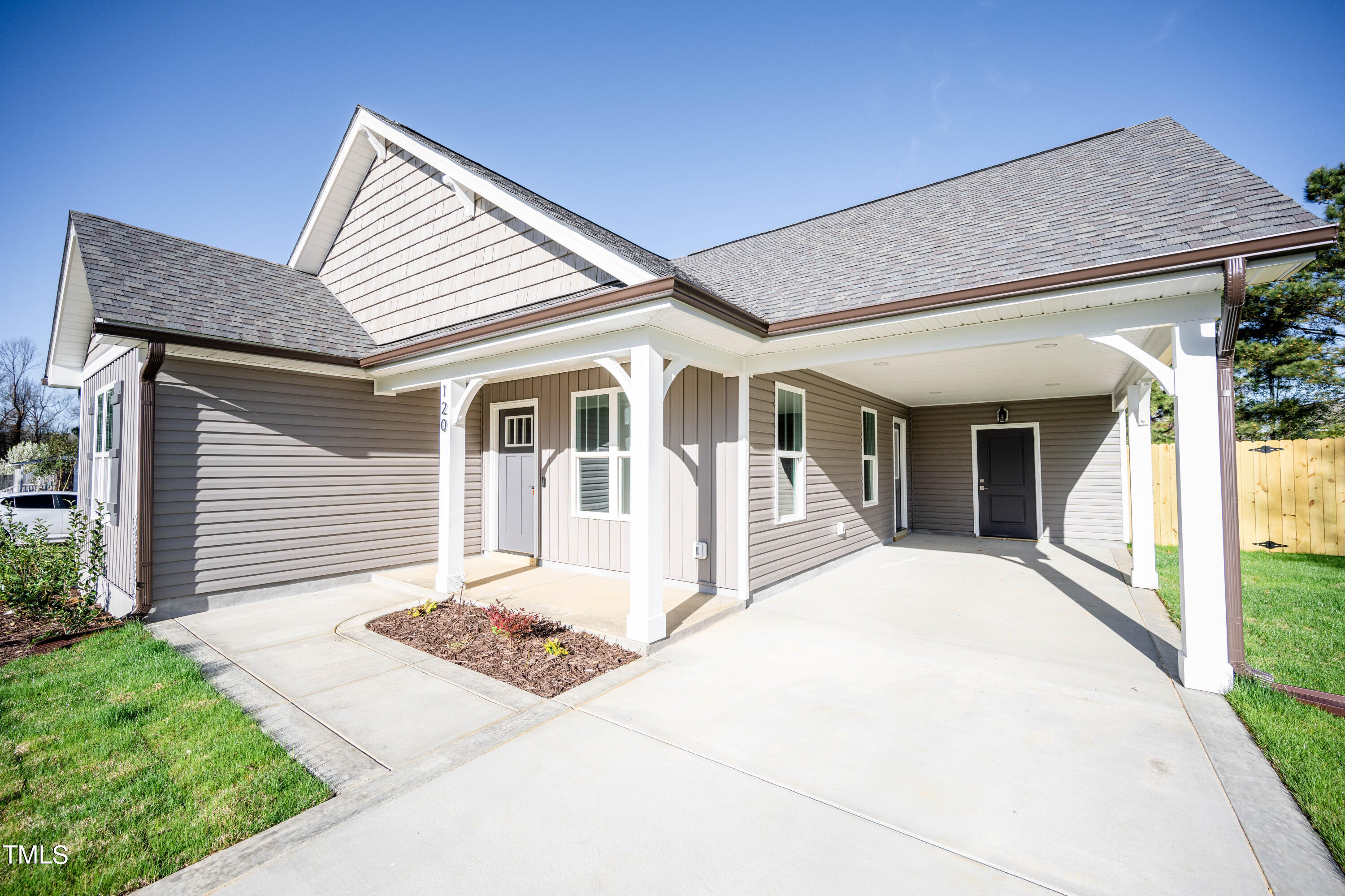120 Jupiter Drive Dunn, NC 28334 - Photo 32 of 40 a front view of a house with a porch