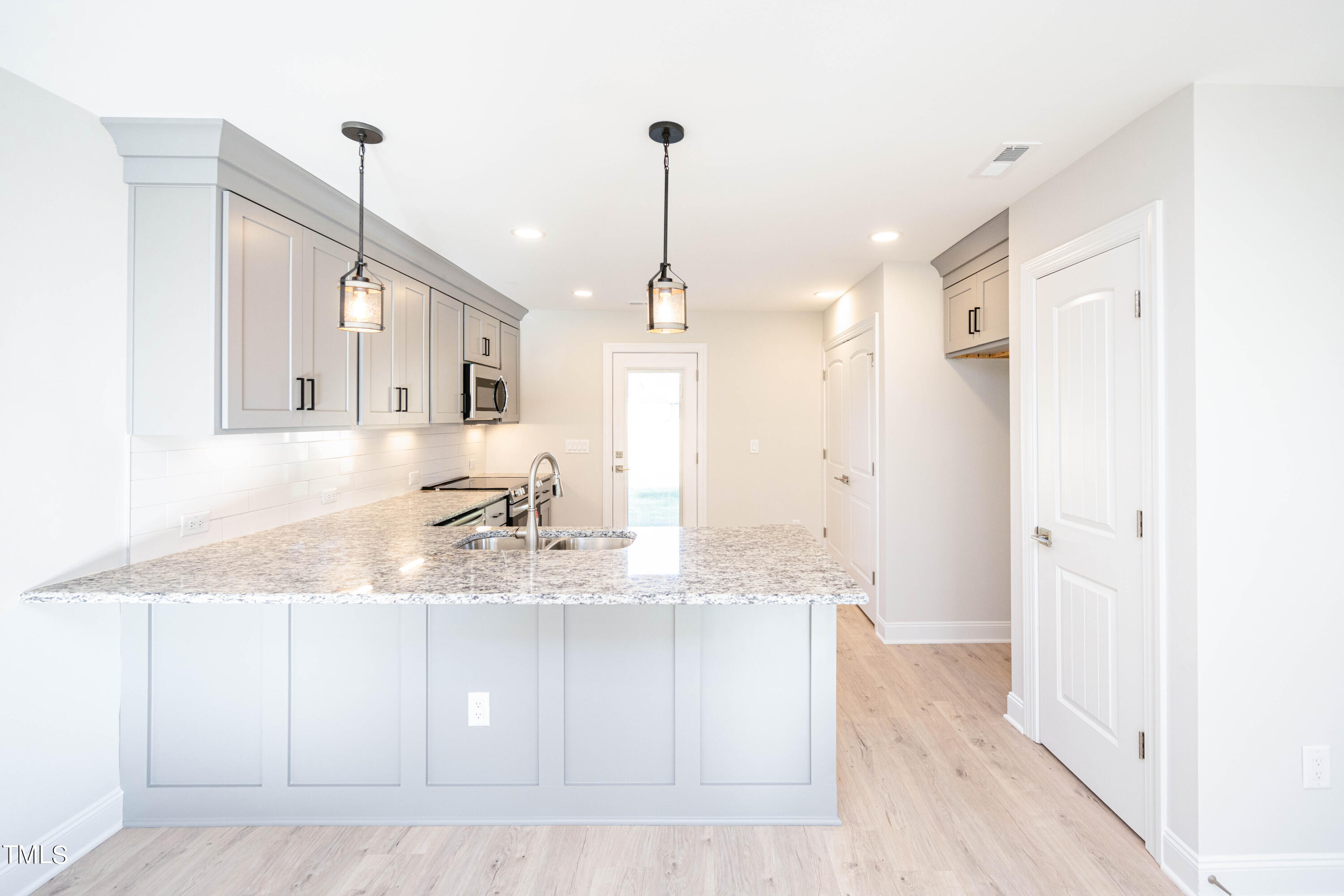 120 Jupiter Drive Dunn, NC 28334 - Photo 6 of 40 a bathroom with a granite countertop sink a mirror and shower