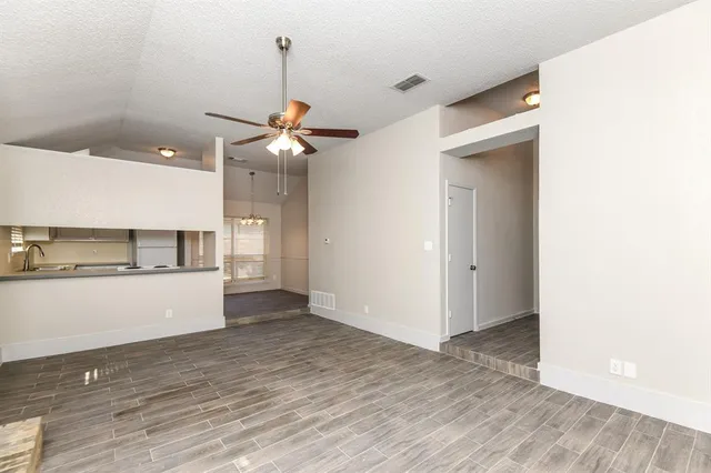 a view of a kitchen with a sink and a stove