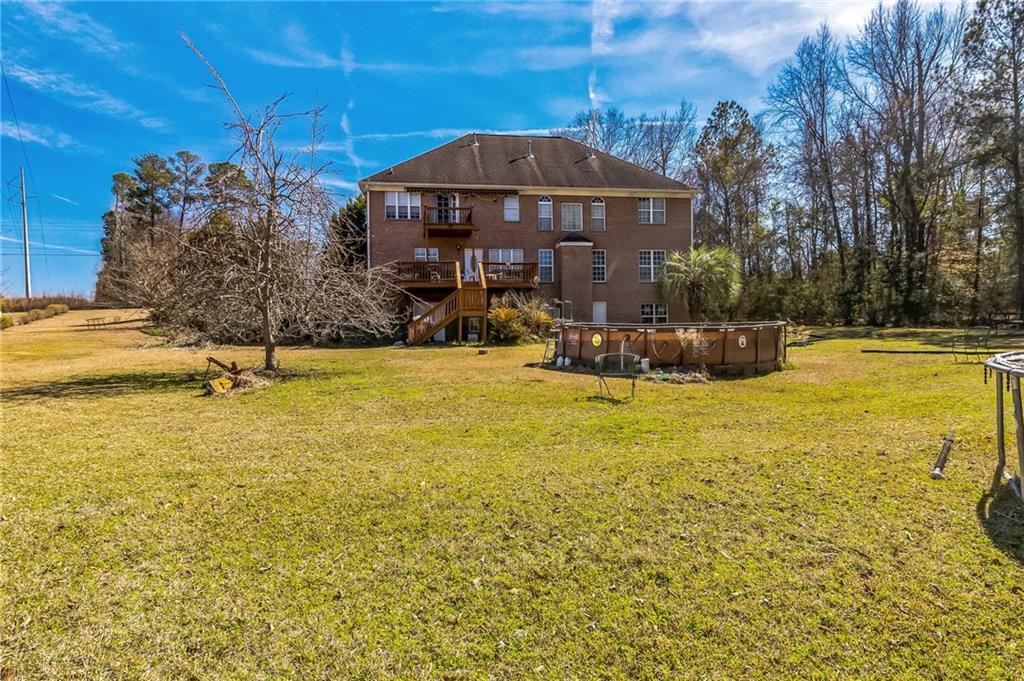 157 Gates Road Lizella, GA 31052 - Photo 13 of 13 a view of a swimming pool with an outdoor space and seating area