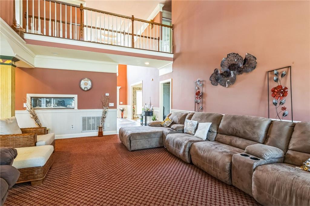 157 Gates Road Lizella, GA 31052 - Photo 4 of 13 a living room with furniture a rug and a window