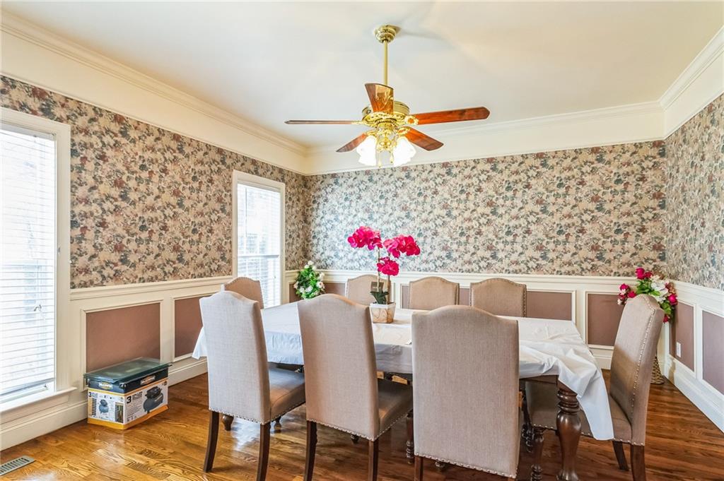 157 Gates Road Lizella, GA 31052 - Photo 6 of 13 a view of a dining room with furniture and a chandelier