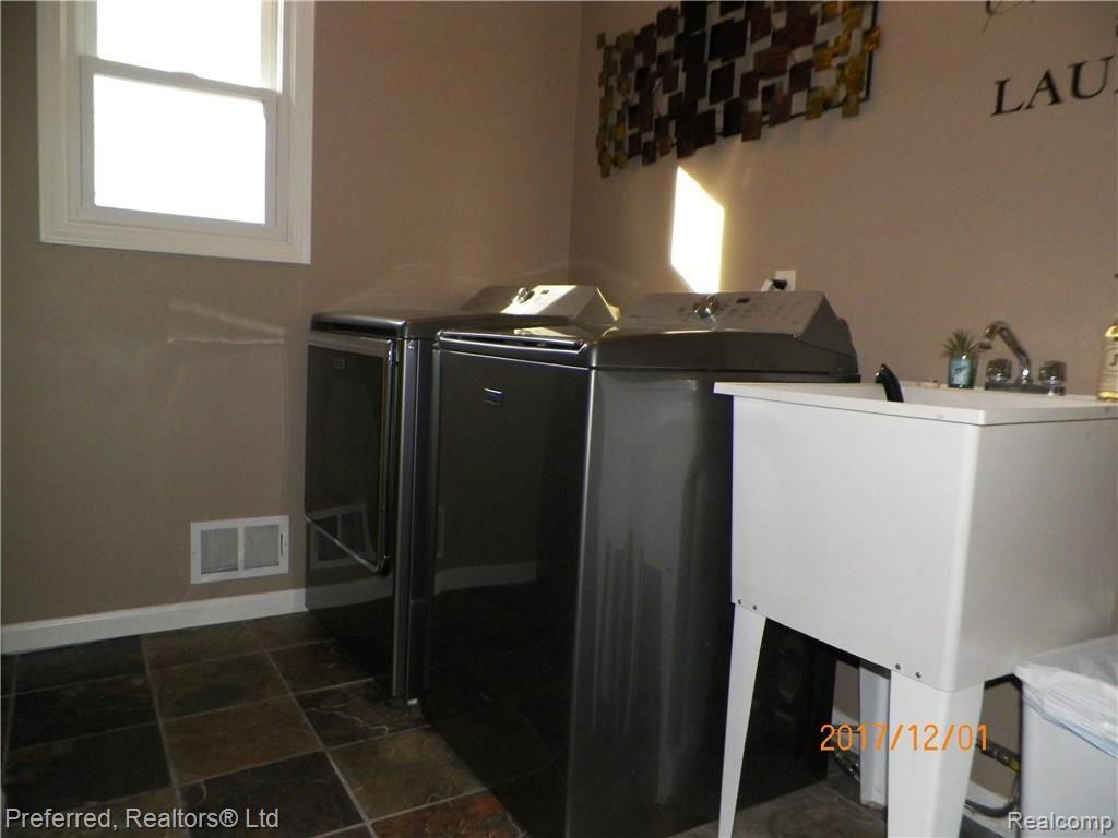 6595 Weed Road Plymouth, MI 48170 - Photo 17 of 42 Slate Floor 1St Floor Laundry!