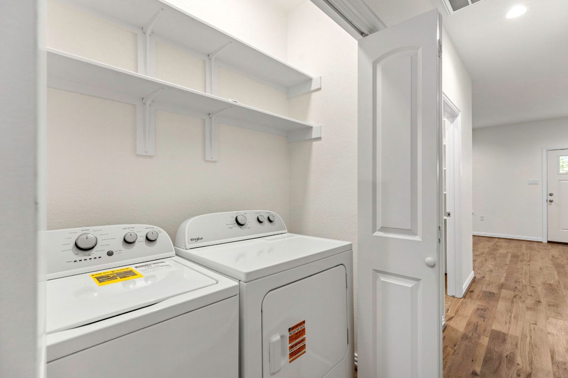1303 Aransas Street Lockhart, TX 78644 - Photo 14 of 16 a view of storage and utility room with washer and dryer