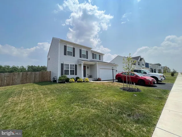 a house view with a garden space