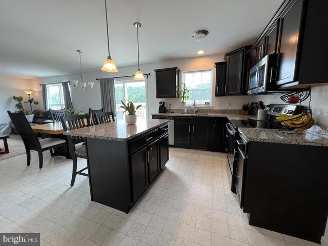 a bedroom with a bed and a television