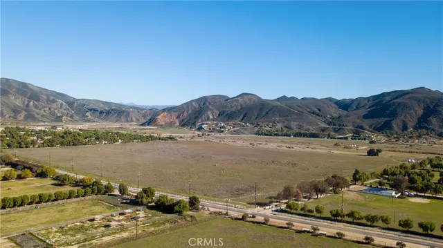 an aerial view of a house with a lake view