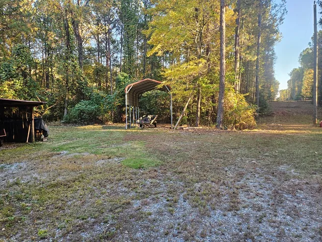 a view of outdoor space with playground and green space