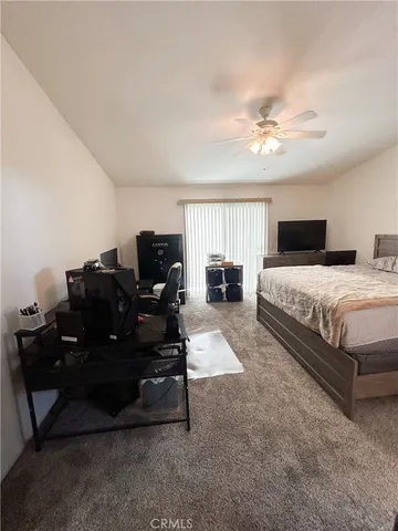 a bedroom with furniture and a window