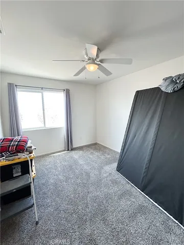 a view of a livingroom with furniture and closet