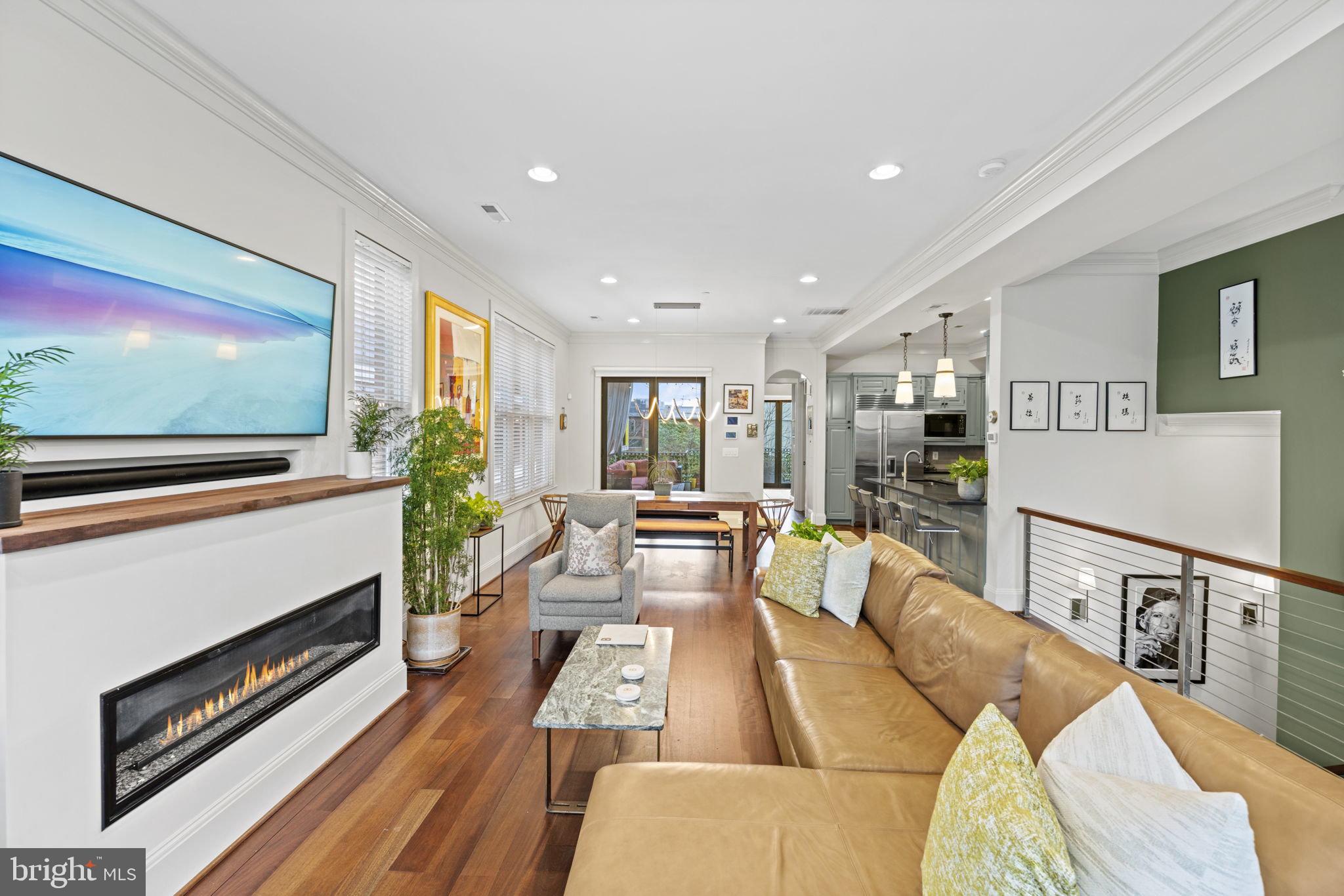 1335 R Street Northwest, Unit 2 Washington, DC 20009 - Photo 2 of 27 a living room with furniture fireplace and flat screen tv
