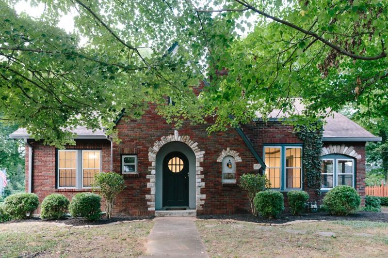 240 Cherokee Road Nashville, TN 37205 - Photo 1 of 22 a front view of a house with garden