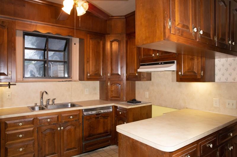 240 Cherokee Road Nashville, TN 37205 - Photo 14 of 22 a kitchen with stainless steel appliances a sink a stove and a refrigerator
