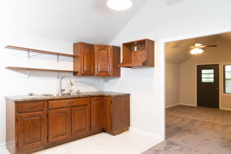 240 Cherokee Road Nashville, TN 37205 - Photo 17 of 22 a kitchen with a sink and cabinets
