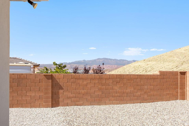 5963 Flattop Drive St. George, UT 84790 - Photo 37 of 45 Outdoor space featuring a gravel ground cover and a concrete block privacy wall