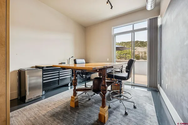 a kitchen with stainless steel appliances granite countertop a stove a sink dishwasher and a refrigerator with wooden floor