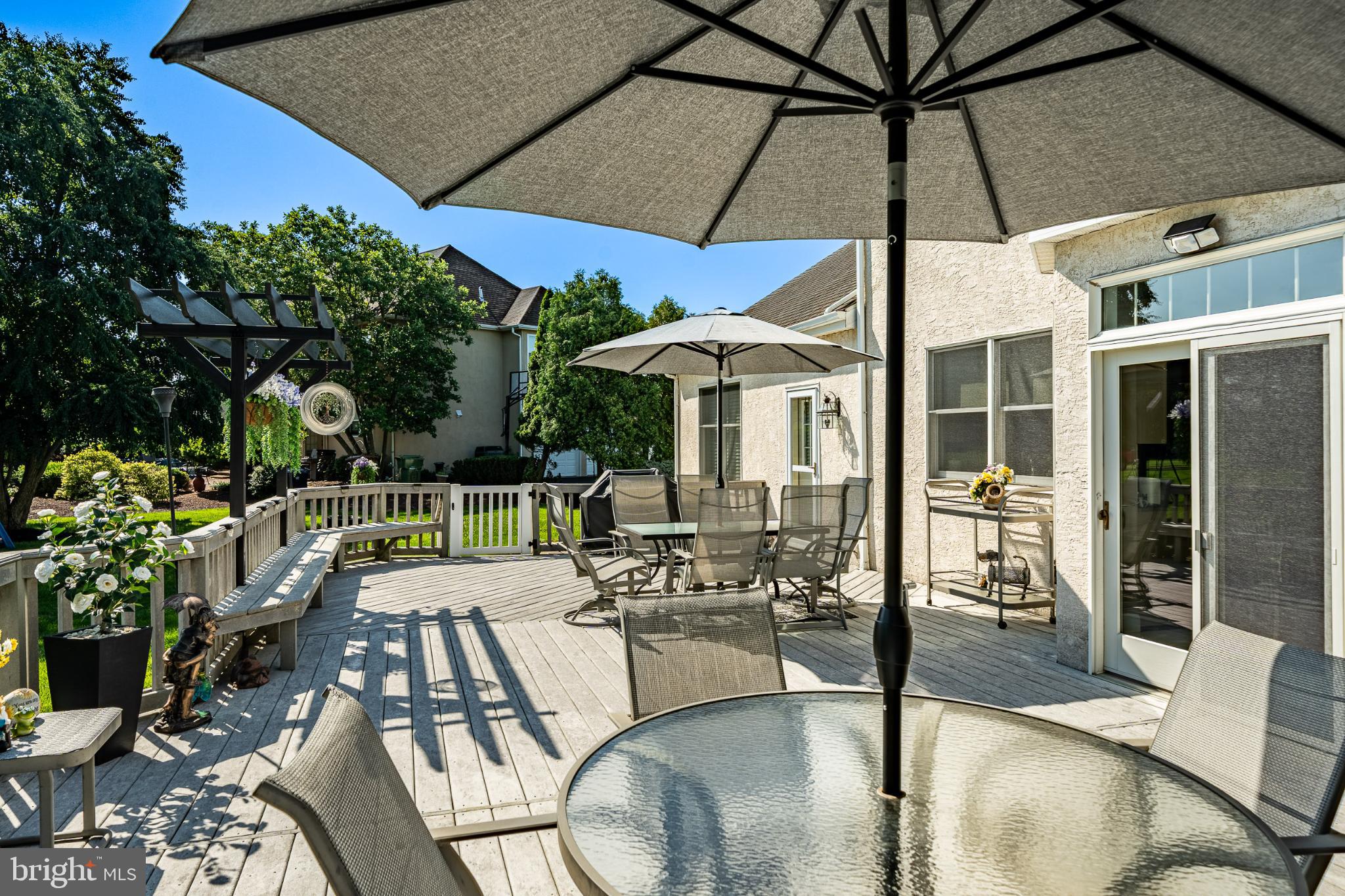 1716 St Georges Road Dresher, PA 19025 - Photo 16 of 90 Sunny patio oasis with inviting shade.