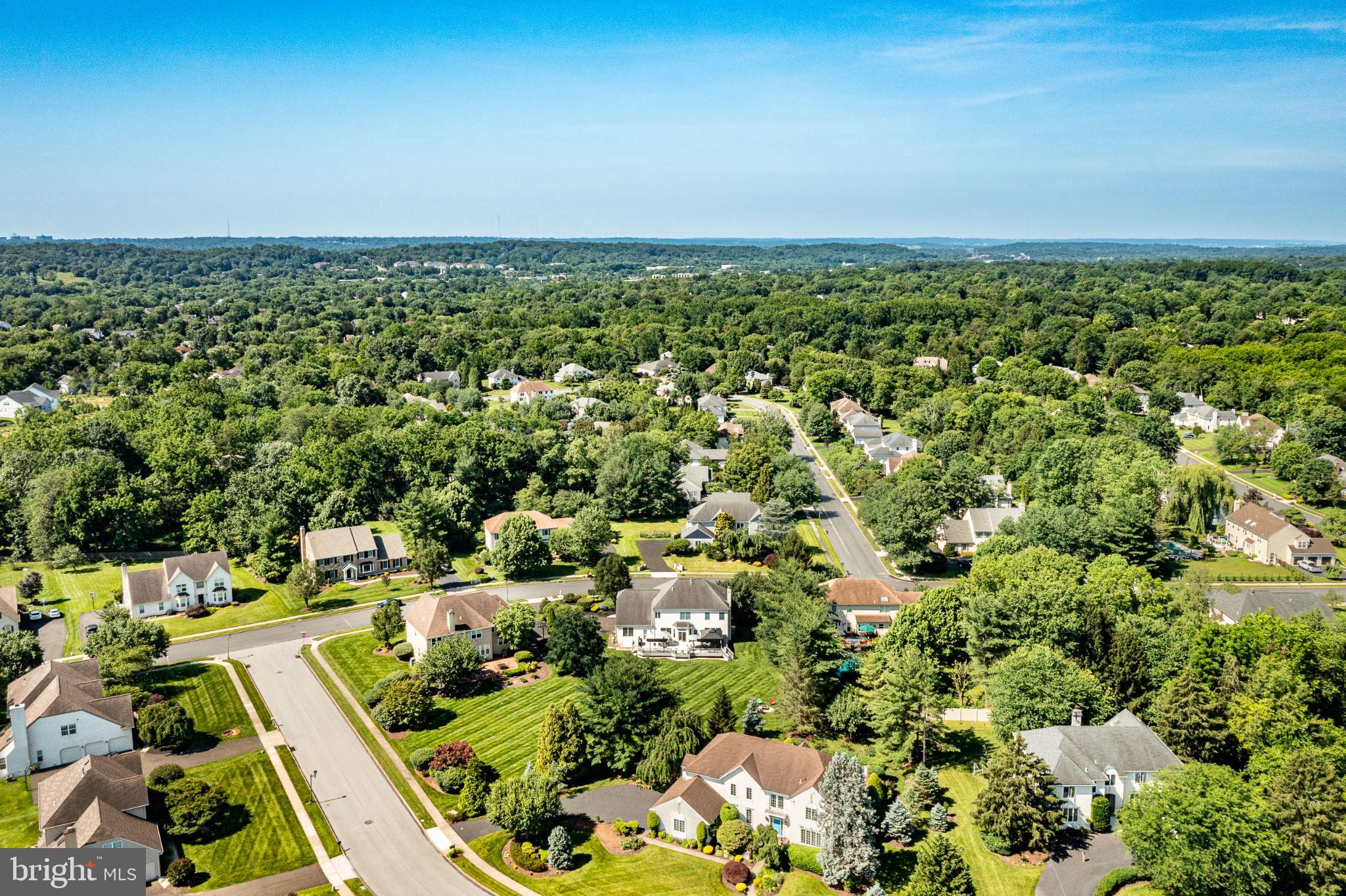 1716 St Georges Road Dresher, PA 19025 - Photo 31 of 90 Lush suburban landscape under clear skies.