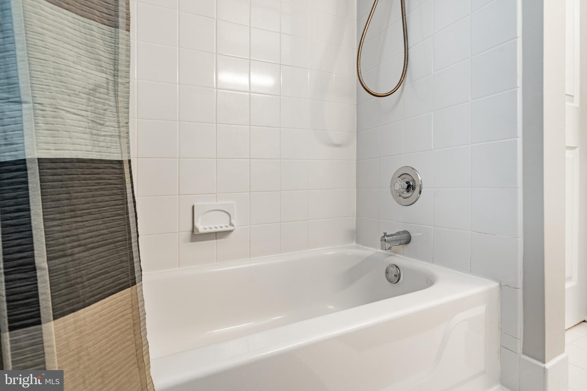 1716 St Georges Road Dresher, PA 19025 - Photo 59 of 90 Modern bathroom with sleek tub and shower.