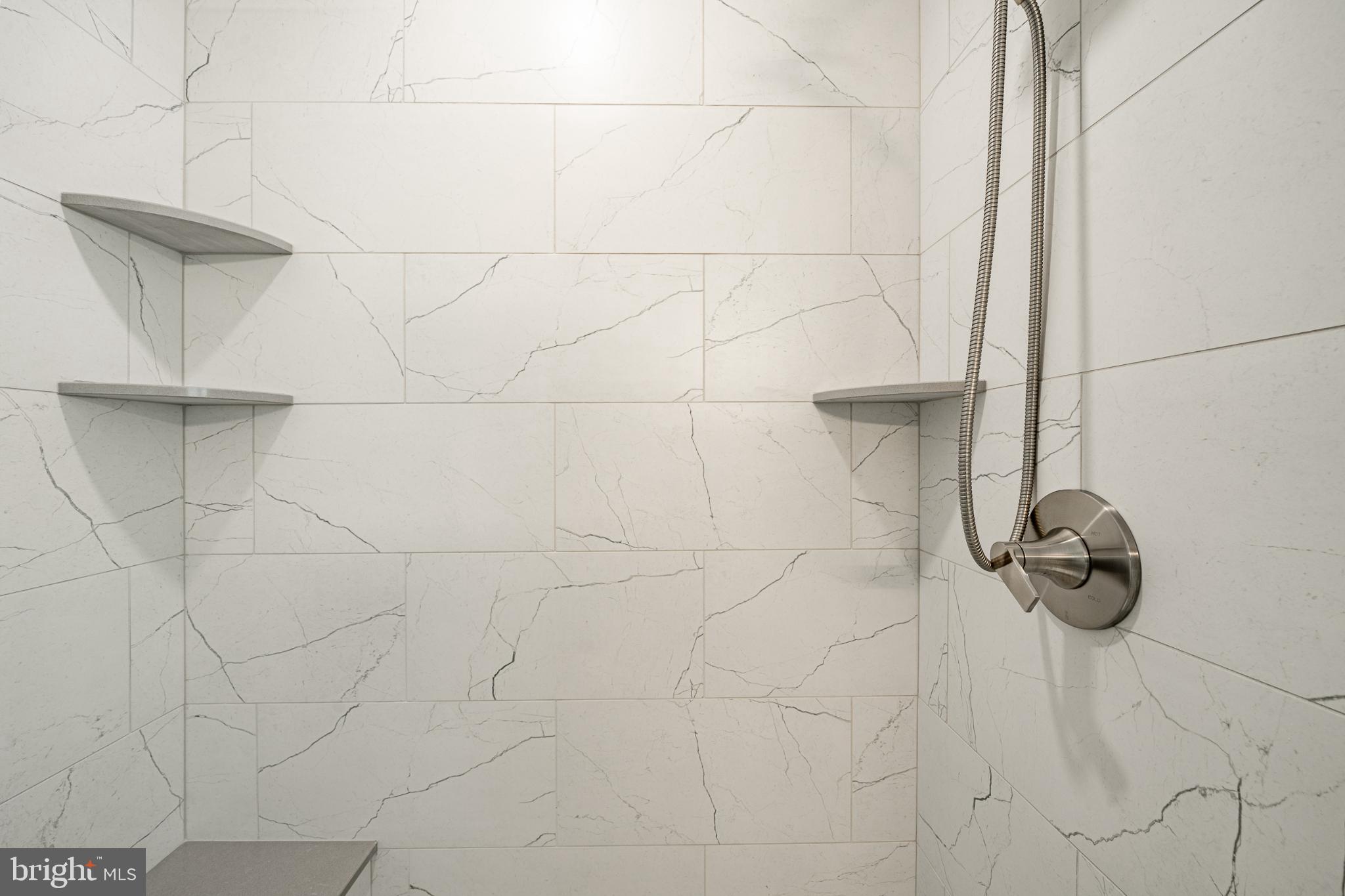 1716 St Georges Road Dresher, PA 19025 - Photo 71 of 90 Sleek marble shower with modern fixtures.