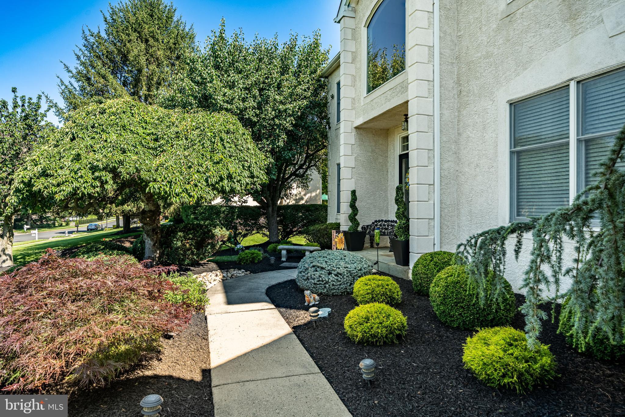 1716 St Georges Road Dresher, PA 19025 - Photo 9 of 90 Lush landscaping welcomes you home.