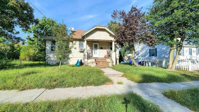 a house with a garden and trees