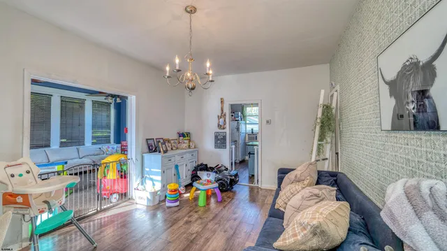 a living room filled with furniture and wooden floor