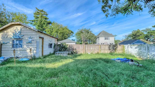 a view of a backyard with a garden and plants